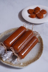 traditional dessert made from glutinous rice cake and palm sugar named dodol jenang in white background