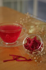 a cup of pink herbal tea