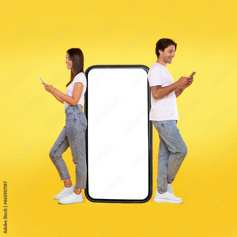 Poster couple leaning on white empty smartphone screen and using phone