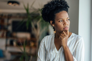 Fototapeta na wymiar Concentrated african-american woman, thinking about work