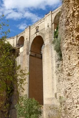 Photo sur Plexiglas Ronda Pont Neuf Partes del Puente Nuevo y los acantilados de El Tajo Ronda,  Málaga, España