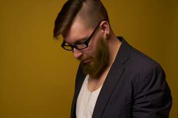 Fototapeta premium bearded man in a black jacket with a book in his hands education