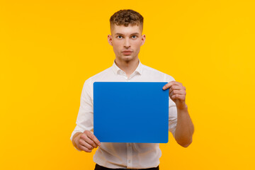 Young businessman is showing the word. Your text here