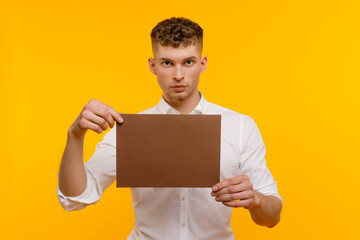 Young businessman is showing the word. Your text here