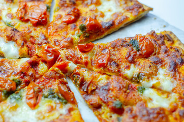 Delicious Neapolitan pizza based on buffalo mozzarella and tomatoes, italian cuisine