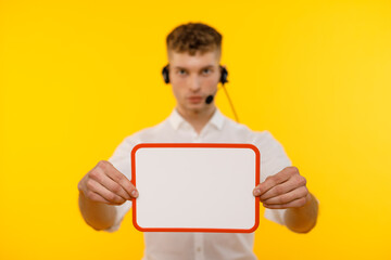 Young businessman is showing the word. Your text here