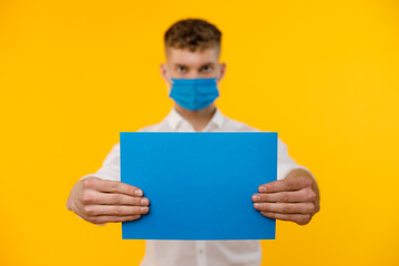 Young businessman is showing the word. Your text here