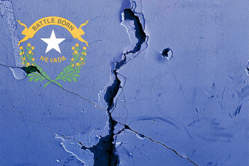National flag of Nevada U.S state on a cracked blue wall