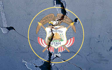 National flag of Utah U.S state on a cracked blue wall