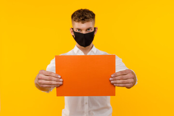 Young businessman is showing the word. Your text here