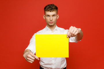 Young businessman is showing the word. Your text here