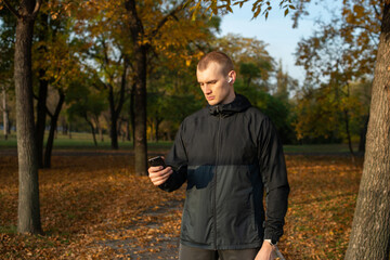 young man running in autumn park