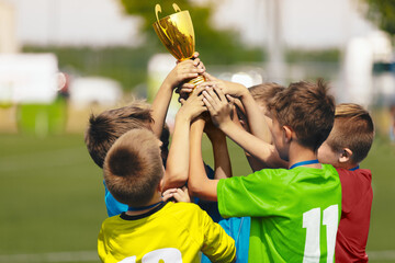 Soccer Team Celebration. Cheerful Children Celebrating Success in Football Tournament Game. Junior...