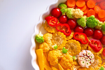 Vegetables for baking in the oven, close-up. Homemade casserole of vegetables. Healthy food background, vegan food