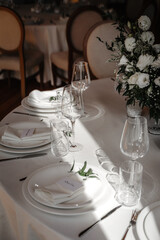 beautiful wedding decor. banquet table with flowers and tableware