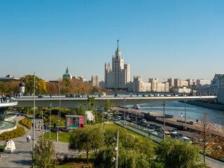Fototapeta na wymiar Moscow, Russia - October 5, 2021: Zaryadye Park. Floating bridge with walking people against the blue sky. Copy space
