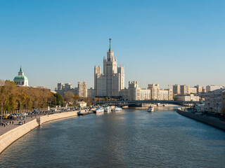 Zaryadye park, floating bridge. View of the Moscow River and the Stalin skyscraper on the Kotelnicheskaya embankment on an autumn day against the background of a blue sky. Copy space