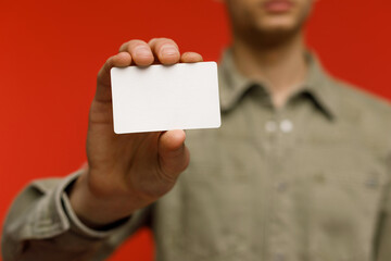 Young businessman is showing the word. Your text here