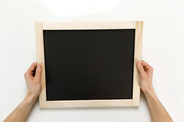 Young businessman is showing the word. Your text here