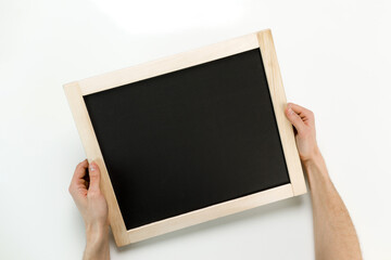 Young businessman is showing the word. Your text here