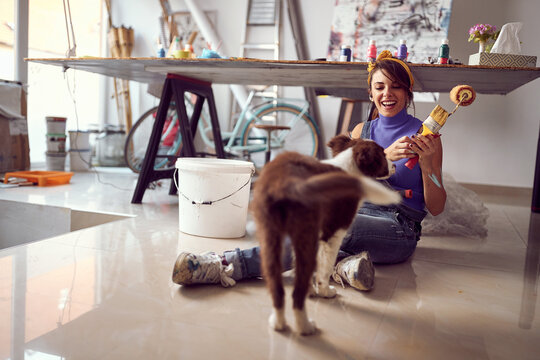  woman artist and her dog at the workshop .Creative inspired mood.