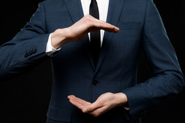 Young businessman is showing the word. Your text here