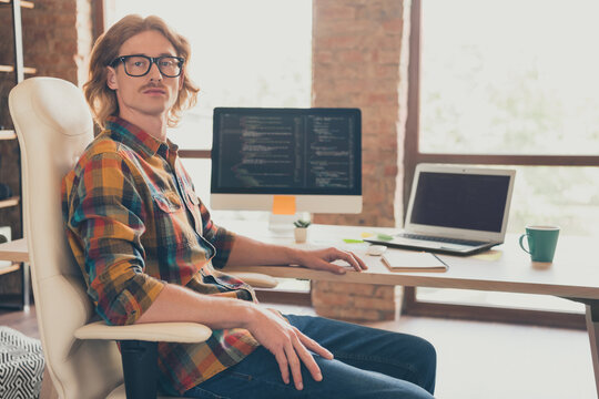 Profile side photo of young man programmer sit chair office wear glasses confident administrator developer indoors