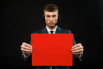 Young businessman is showing the word. Your text here