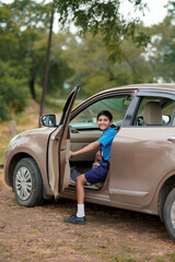 Indian school boy in car