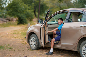 Indian school boy in car