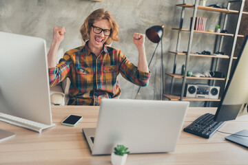 Photo of young man it specialist happy positive smile rejoice victory success achievement look...