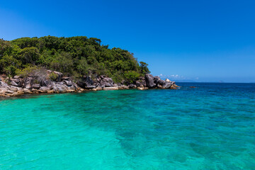 Fototapeta premium The beautiful and secluded Moken Bay of Boulder Island in Myanmar covering with so many boulders on the beach