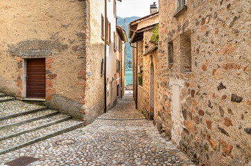 Fototapeta na wymiar Narrow cobblestone streets in the picturesque village Morcote on the Lake Lugano, Ticino, Switzerland.