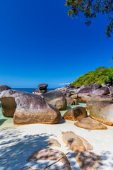 The beautiful and secluded Moken Bay of Boulder Island in Myanmar covering with so many boulders on the beach