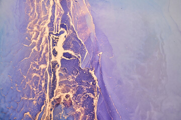 Luxury abstract background in alcohol ink technique, purple gold liquid painting, scattered acrylic blobs and swirling stains, printed materials