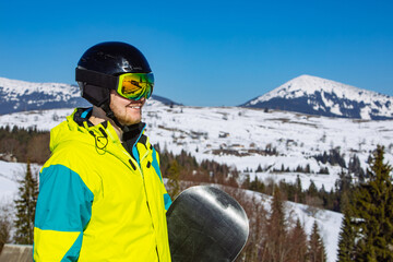 man in helmet and ski mask. reflection. winter activity