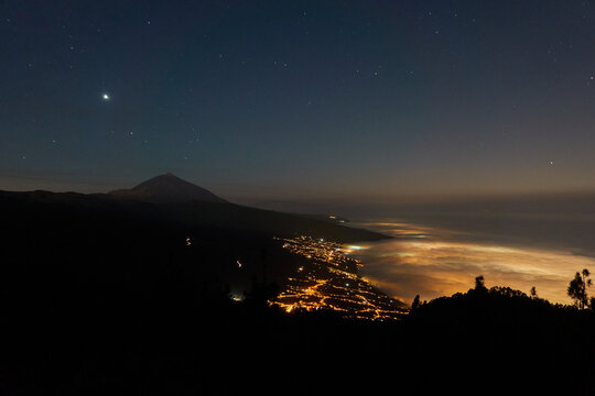 El Teide and the La Orotava valley seen at night from the Chipeque viewpoint. Tenerife. Canary Islands. Spain