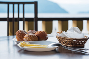 Outdoor terrace with breakfast in the mountains. A table in a restaurant with a view of the mountains.