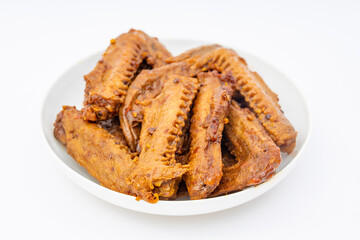 A dish of delicious spicy marinated duck wings