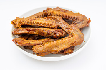 A dish of delicious spicy marinated duck wings