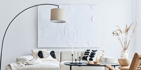 Domestic interior of living room with design modular sofa, black coffee table, lamp, armchair,...