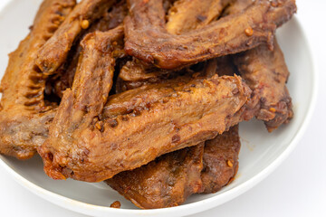 A dish of delicious spicy marinated duck wings