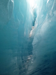 Inside the ice grotto of dramatically fast melting Rhone Glacier tongue (glacier du Rhône), Gletsch, Obergoms, Wallis, Valais, Switzerland
