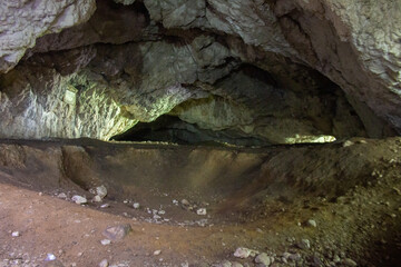 Cave with dim light shining in