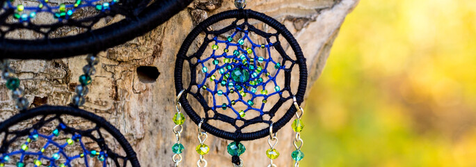 banner of Handmade dream catcher with feathers threads and beads rope hanging