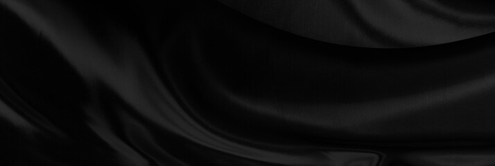 Black gray satin dark fabric texture luxurious shiny that is abstract silk cloth background with patterns soft waves blur beautiful.