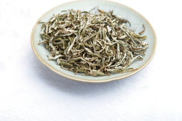 Chinese Fujian boutique fried dried tea leaves in a plate