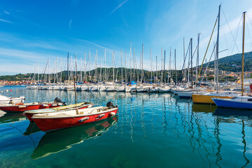 Port with many sailing boats moored, small Lerici town, tourist resort on the coast of the Gulf of La Spezia, Mediterranean sea, Liguria, Italy, Southern Europe.