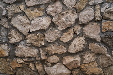 Old brick wall, old texture of stone blocks closeup
