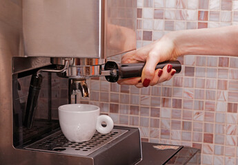 Making espresso on coffee machine